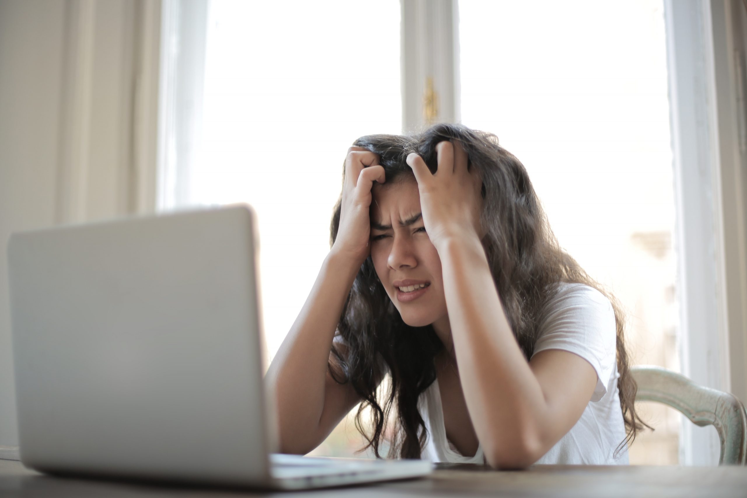 stressed woman with laptop